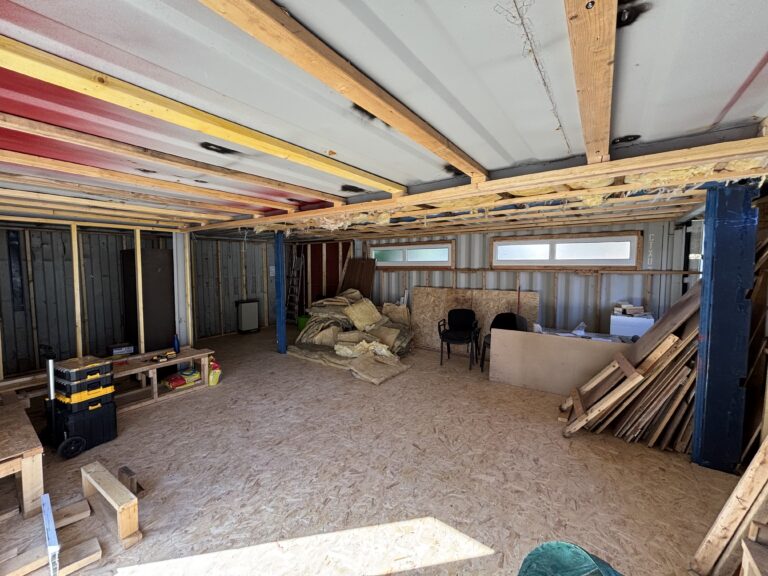 Timber framing, insulation and floorboards inside the Slice of Hope containers