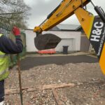 Excavator on the cleared Slice of Hope site at Lowton Community Hub
