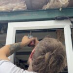 Window being fitted into a Slice of Hope container wall